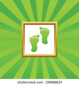 Image of human footprint in golden frame, on green abstract background