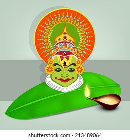 Image of kathakali dancer face with heavy makeup on banana leaf and illuminated oil lit lamp on gray and light gray background.