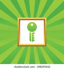 Image of key in golden frame, on green abstract background