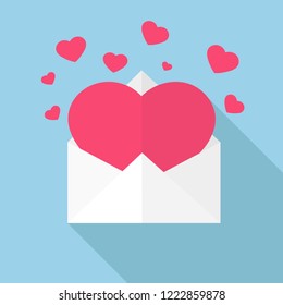 An image of a large pink heart in an envelope