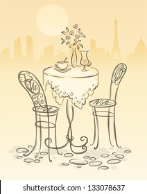 image of a little table and two chairs ready for breakfast against the background of Paris cityscape with Eiffel tower in the morning
