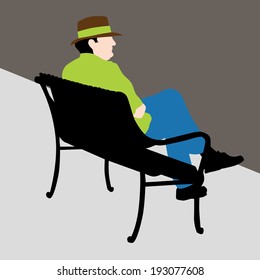 An image of a man sitting on a bench.
