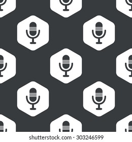 Image of microphone in hexagon, repeated on black