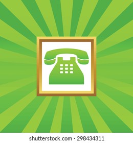 Image of old phone in golden frame, on green abstract background