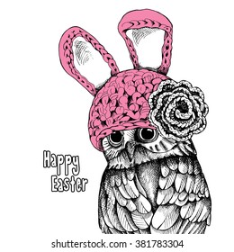 The image of the owl in the Bunny hat with knitted flower. Vector illustration.