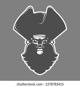 Image of pirate in high contrast. Face with beard, pirate hat. Strong expression Monochromatic Overhead light.