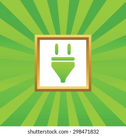 Image of plug in golden frame, on green abstract background