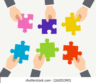 Image of puzzle in 6 hands