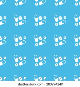 Image of several pills and tablets, repeated in straight lines on blue background