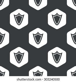 Image of shield in hexagon, repeated on black