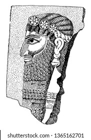 The image shows an Asyrian. It is made of stone and is the face on one side. It has a lid like a crown, vintage line drawing or engraving illustration.