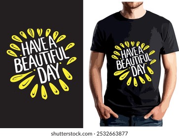 The image shows a black t-shirt with the phrase "Have a Beautiful Day" in white text, surrounded by yellow teardrop shapes, creating a bright and cheerful design.