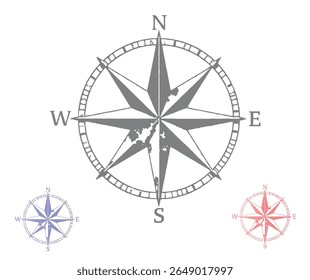 The image shows a detailed compass rose with directional letters and two smaller colored versions, all set against a white background.