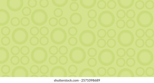 The image shows a pattern of variously sized circles on a light green background.The circles are arranged in a seemingly random but evenly distributed manner.