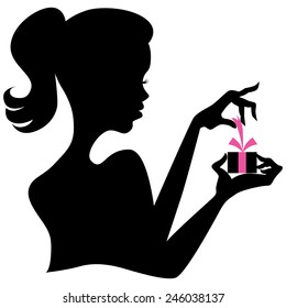 An image of a silhouette of a girl opening a gift box.