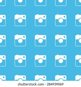 Image of square camera, repeated in straight lines on blue background