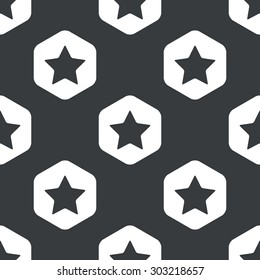 Image of star in hexagon, repeated on black