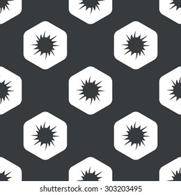 Image of starburst in hexagon, repeated on black