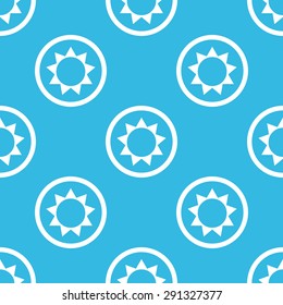 Image of sun in circle, repeated on blue background