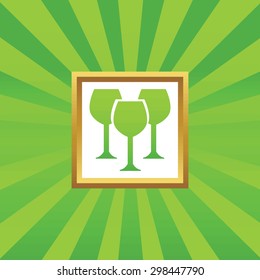 Image of three wine glasses in golden frame, on green abstract background