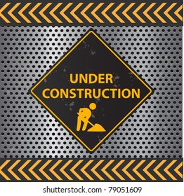 Image of a Under Construction sign with a metallic background texture.