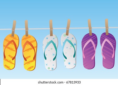 Image of various colorful flip flops hanging on a clothes line isolated on a blue sky background.