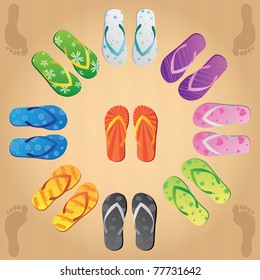 Image of various colorful flip flops on a sandy background.