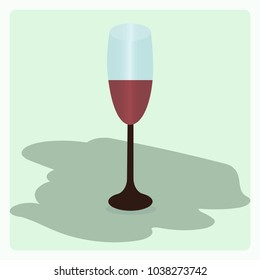 Image of a wine glass with red wine inside at the light green background