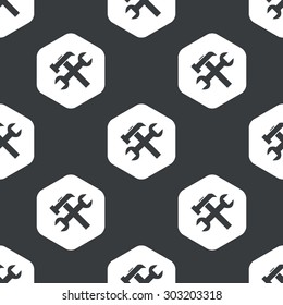 Image of wrench and hammer in hexagon, repeated on black