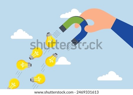 Imagination to create new ideas, businessman with magnet to magnetize light bulb ideas.