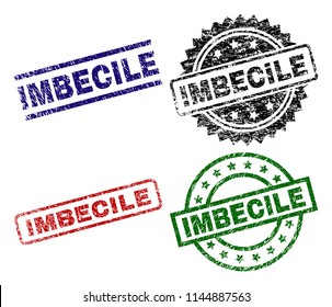 IMBECILE seal prints with damaged surface. Black, green,red,blue vector rubber prints of IMBECILE tag with retro surface. Rubber seals with circle, rectangle, medallion shapes.
