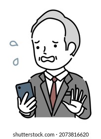 An impatient senior male business person operating a smartphone
