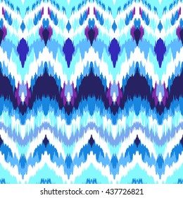 Impressive fashion print. Modern look of ethnic indian ornaments. Seamless pattern in bright blue colors. Tie dye effect and boho chic style. Creative hippies textile. 