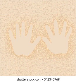 Imprint of children's hands on background of sand
