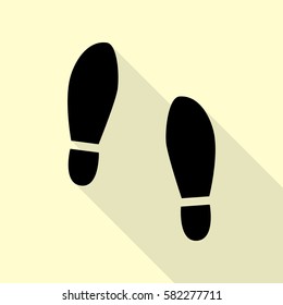 Imprint soles shoes sign. Black icon with flat style shadow path on cream background.