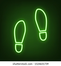 Imprint soles shoes sign. Green neon icon in the dark. Blurred lightening. Illustration.