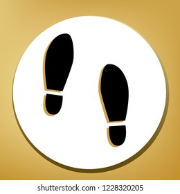 Imprint soles shoes sign. Vector. Black icon with light brown shadow in white circle with shaped ring at golden background.