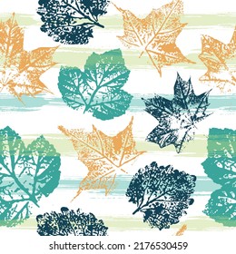 Imprints abstract leaves poinsettia mix repeat seamless pattern. Cute pattern of beautiful prints of leaves painted watercolor by hand. Mixed media artwork.