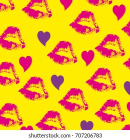 Imprints of lipstick on the yellow background 