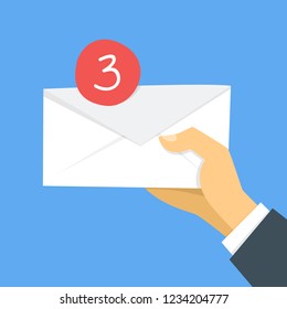 Income message in email concept. Hand holding envelope as a metaphor of new mail. Communication in the internet. Flat vector illustration