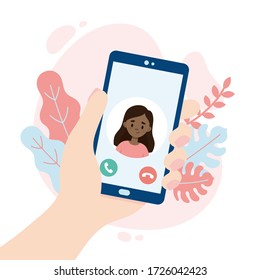 Incoming video call. Hand holding a smartphone. Cute girl making a video call. People using a video call app while social distancing.