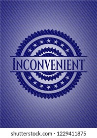 Inconvenient emblem with jean texture