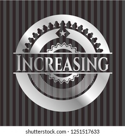 Increasing silvery emblem