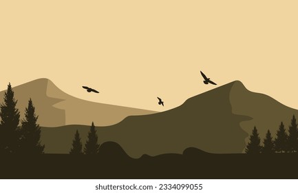 Incredible mountain view with silhouette of fir trees from outside the city
