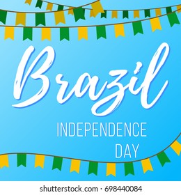 Independence Day in Brazil. Vector illustration with inscription and garlands with flags on a blue background