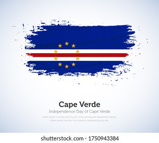 Independence day of Cape Verde country. Abstract flag in shape of paint brush stroke with shiny colored background