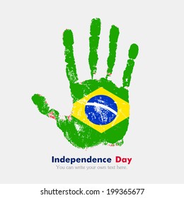 Independence Day. Grungy style. Hand print and five fingers. Used as an icon, card, greeting, printed materials.  Flag of Brazil