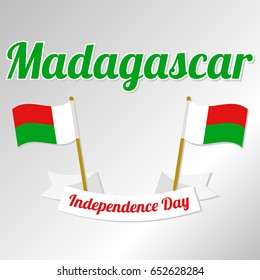 Independence Day in Madagascar. Vector illustration with ribbon, inscription and Madagascar flags on a light gray background