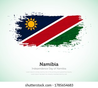 Independence day of Namibia country. Abstract flag in shape of paint brush stroke with shiny colored background