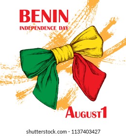 Independence Day of the state of Benin. August 1. A patriotic national holiday in the African country. A bow with a color Benin against the background of brush dabs. The manual drawing in style the